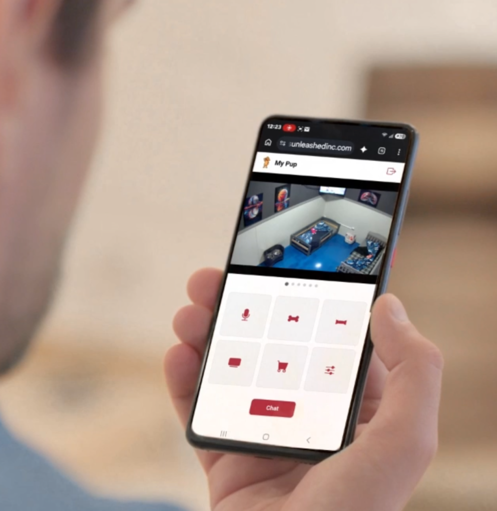 Dog owner using CU SuiteConnect to interact with a private boarding suite